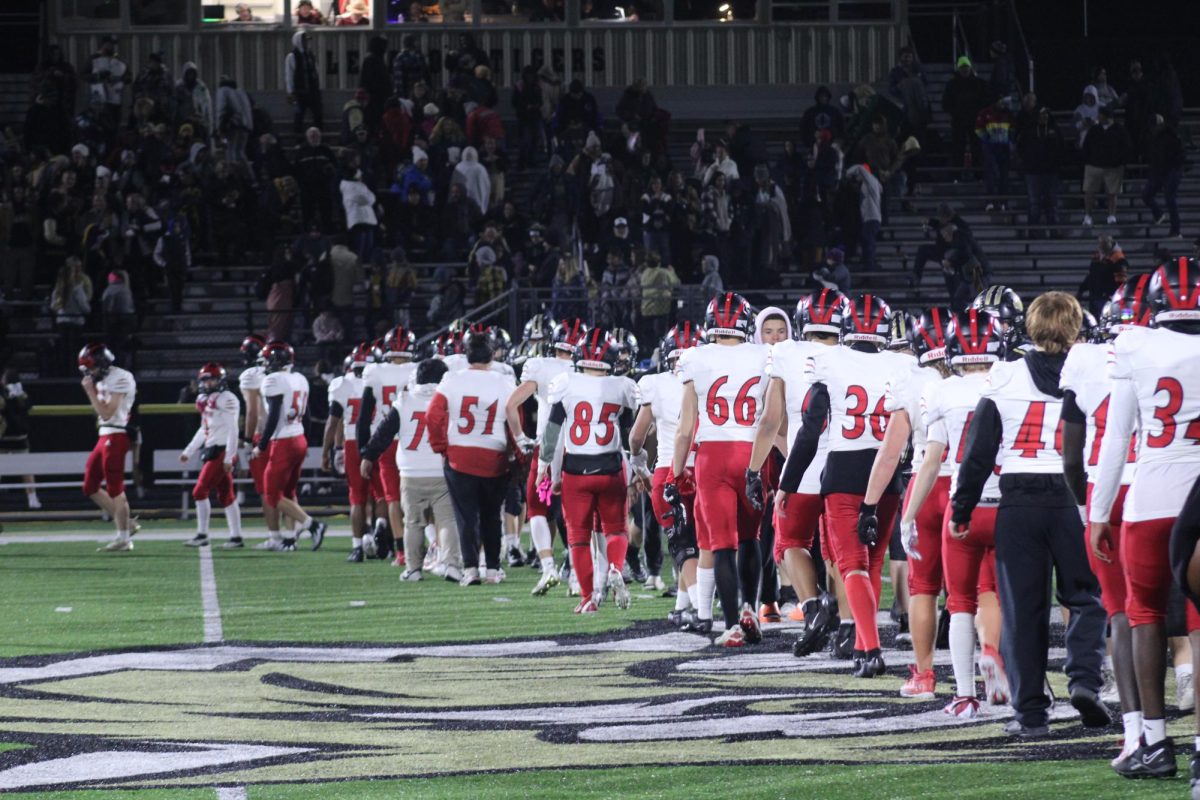 Logansport High School Football players shake hands with Lebanon players as a sign of good sportsmanship. 