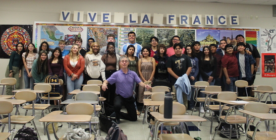 Students put a smile on their faces when it's time to take their French Club picture.
(Courtesy of French Club)

