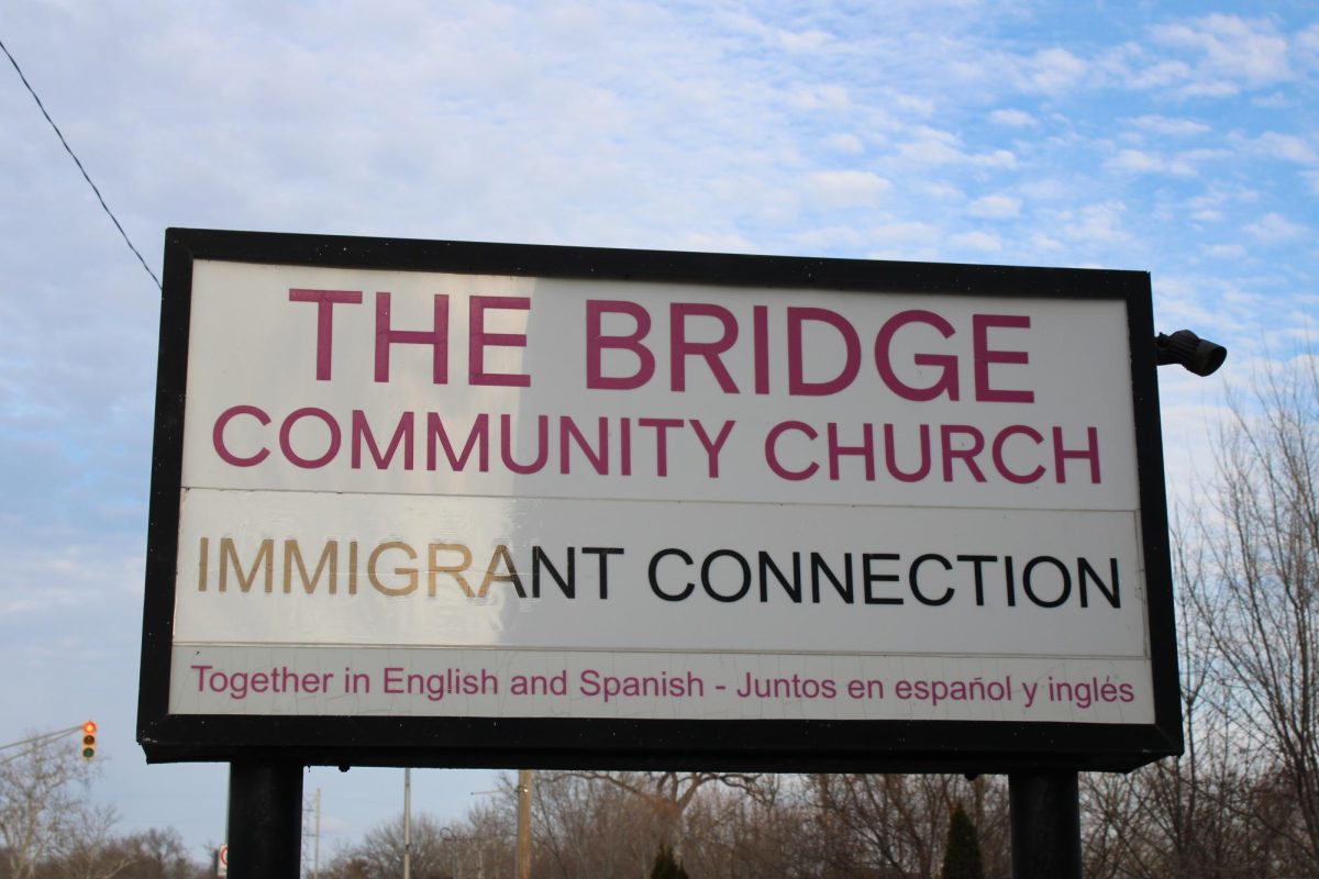 The sign outside of the bridge community church/immigration connection center. the bridge community church acts like a "home base" for the immigration connection.