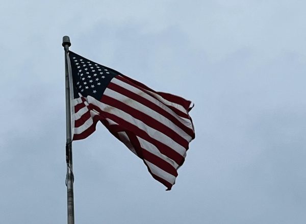 The American Flag waves around in the wind outside of the main entrance of Logansport High School.