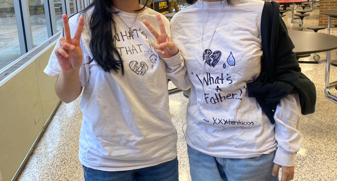 Sophomores Nohelia Molina and Su Htike match for Valentine's day, using the meme "what's that... what's a father?" from TikTok and said by Xxxtentacion.