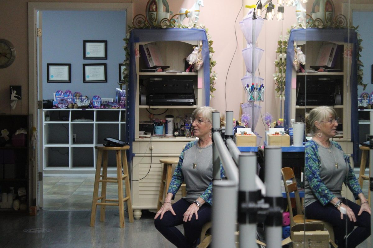 Teacher Amii McCord observes her students as they practice.