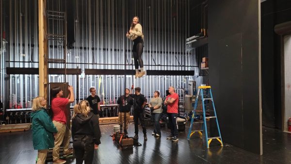 In preparation for the LHS Drama Department’s production of Matilda, select tech members receive training on how to fly lead senior Ava Martin.