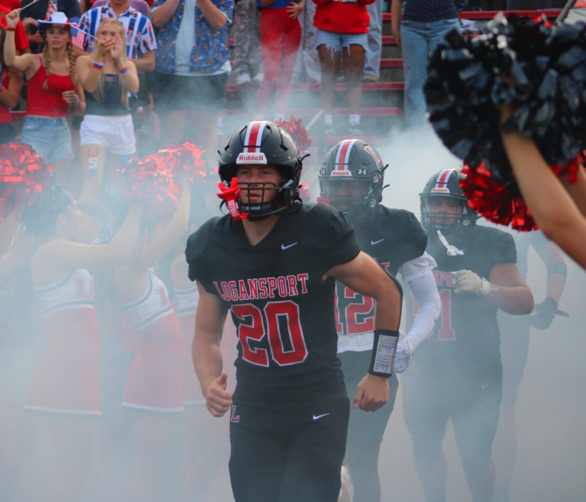 Junior Elliot Baldini hustles onto the field, to compete for the trophy, named after his grandfather, Don Baldini.