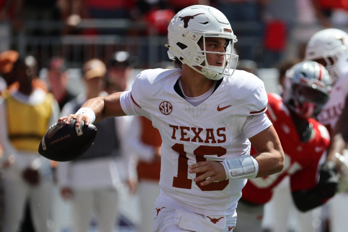 Aug 30, 2025; Columbus, Ohio, USA; Texas Longhorns quarterback Arch Manning (16) drops back to pass against the Ohio State Buckeyes in the first half at Ohio Stadium. Mandatory Credit: Joseph Maiorana-Imagn Images