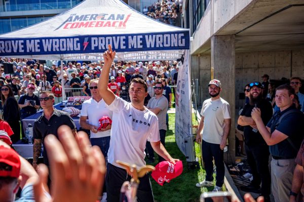 U.S. right-wing activist and commentator Charlie Kirk throws hats to the crowd shortly before he was shot at a Utah Valley University speaking event in Orem, Utah, U.S. September 10, 2025. Trent Nelson/The Salt Lake Tribune via REUTERS.