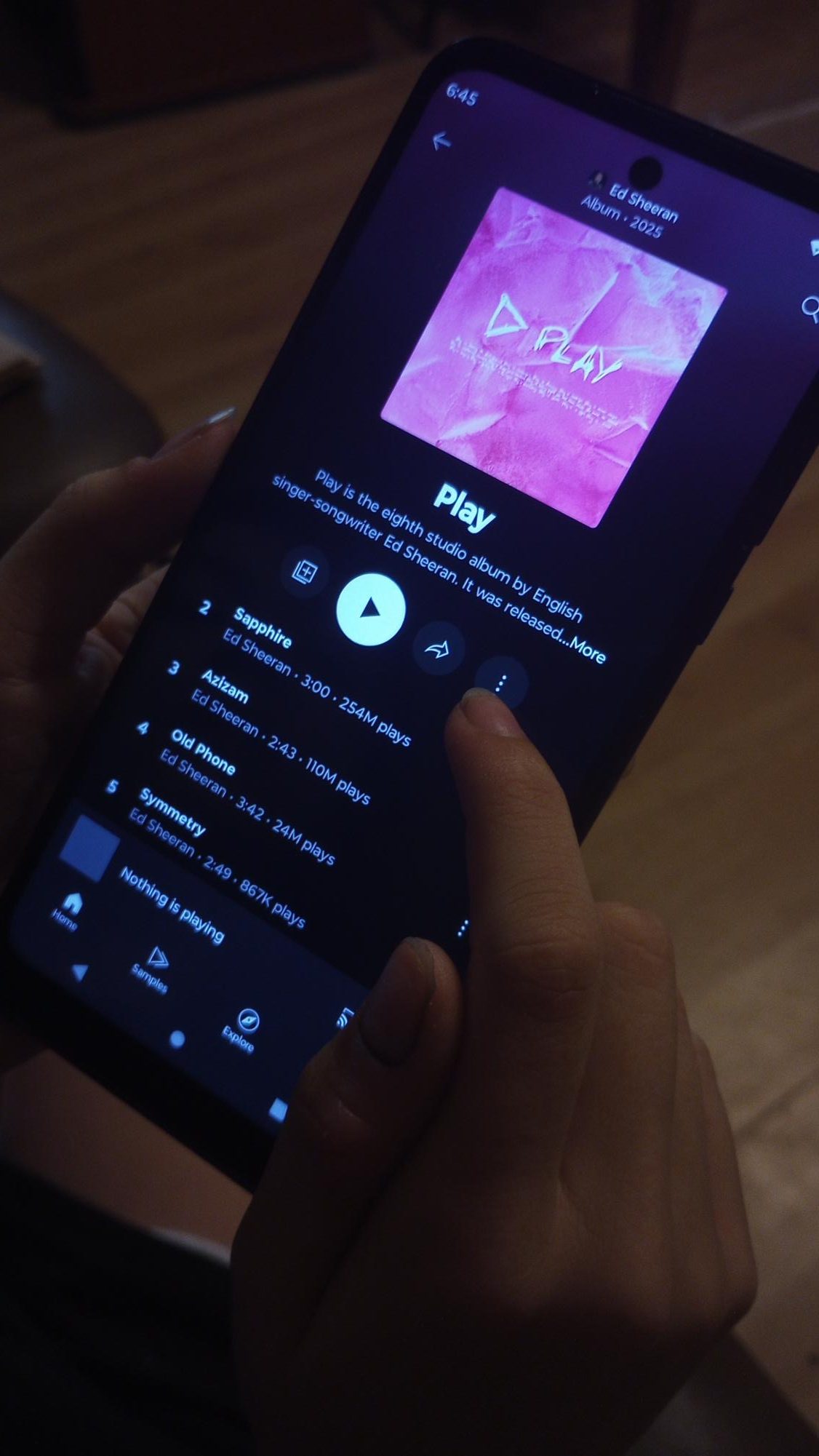 A student scrolls through Ed Sheeran's latest album, "Play".