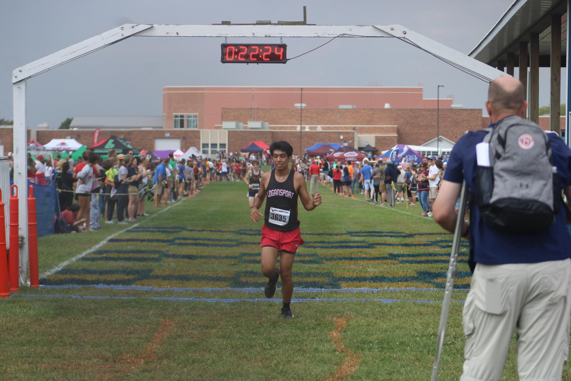 Senior Eric Garcia coming through the finish line with a time of 22:24. Eric alongside the rest of the boys team ran at the New Prairie Invite on Sept. 20.