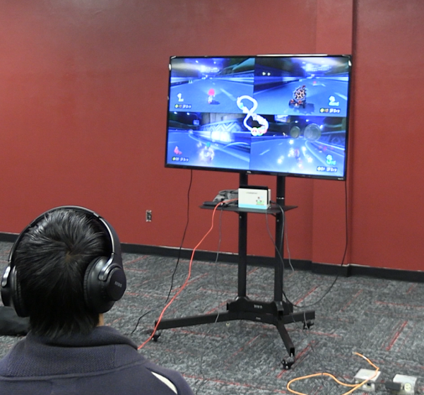 An eSports member plays before the match in ten minutes. Along with other members, it's an expectation to prepare and focus for every match.