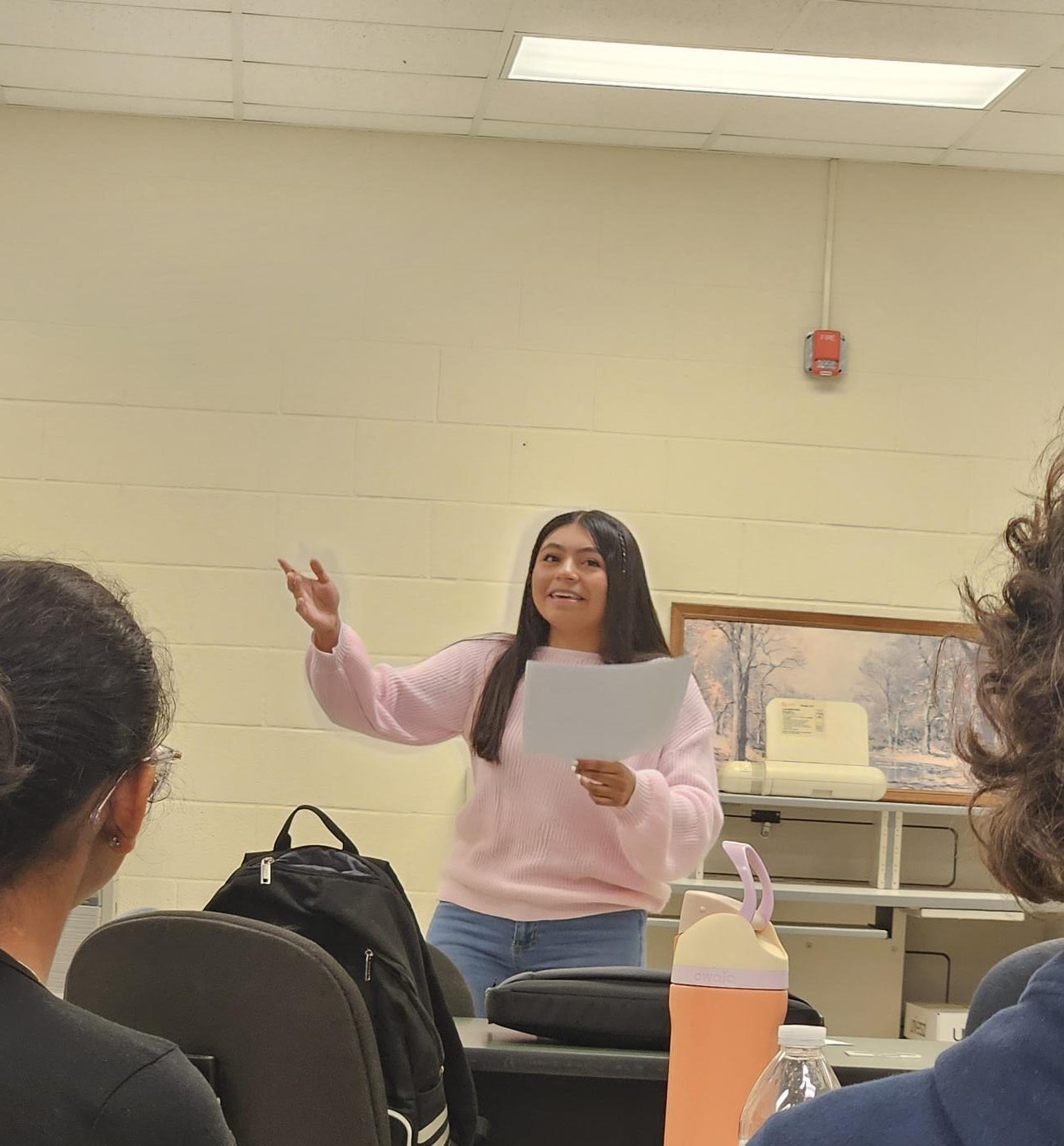 In a separate room stands junior Madilie Franco expressing her speech to the team as they intently listen. Afterwards, she received comments of praise and advice.