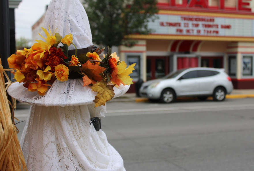 A ghost scarecrow with Logansport’s local State Theatre in the background. 
