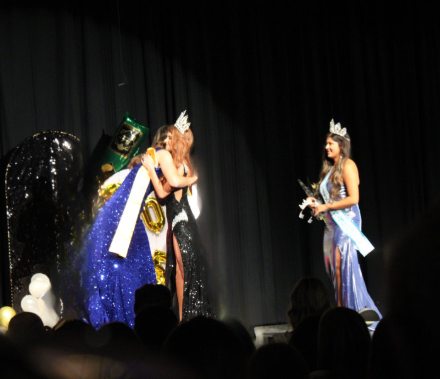 Pageant winner of 2024 hugging the new Oktoberfest queen for 2025. After being announced as a winner, there were many hugs exchanged.