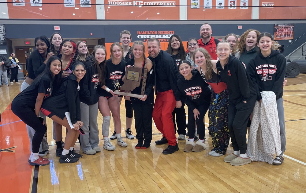 Posing together in the Hamilton Heights High School gymnasium, the LHS Girls Wrestling teams celebrates a first place victory at their team Sectional Tournament. (Courtesy of Erin Williams)
