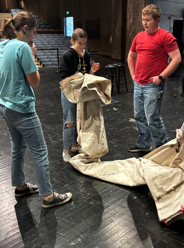 From left to right, Cunningham, Ping and Adams work together to figure out what went wrong in their fold and how to fix it.