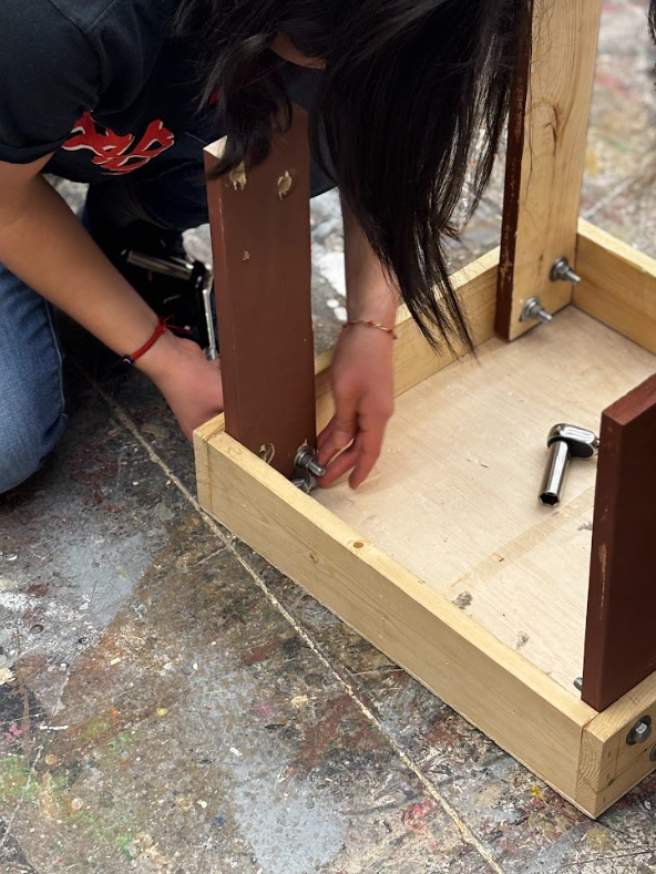 Miranda-Castro makes quick work of the leg-a-platform using her master carpenter skills.