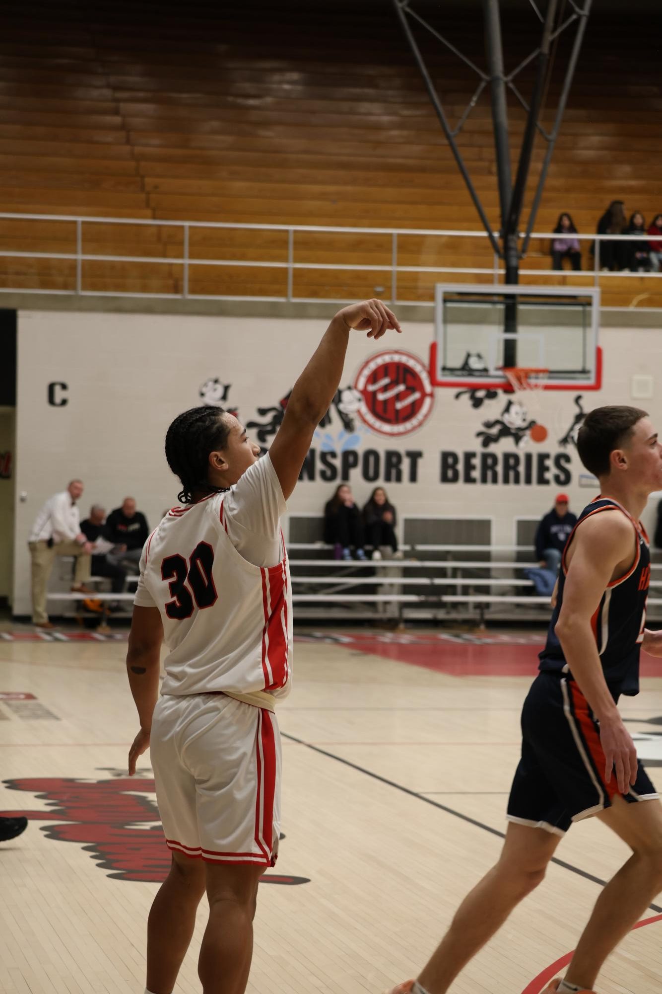 Quincy Jackson, varsity basketball player, shoots a three pointer against Harrison.