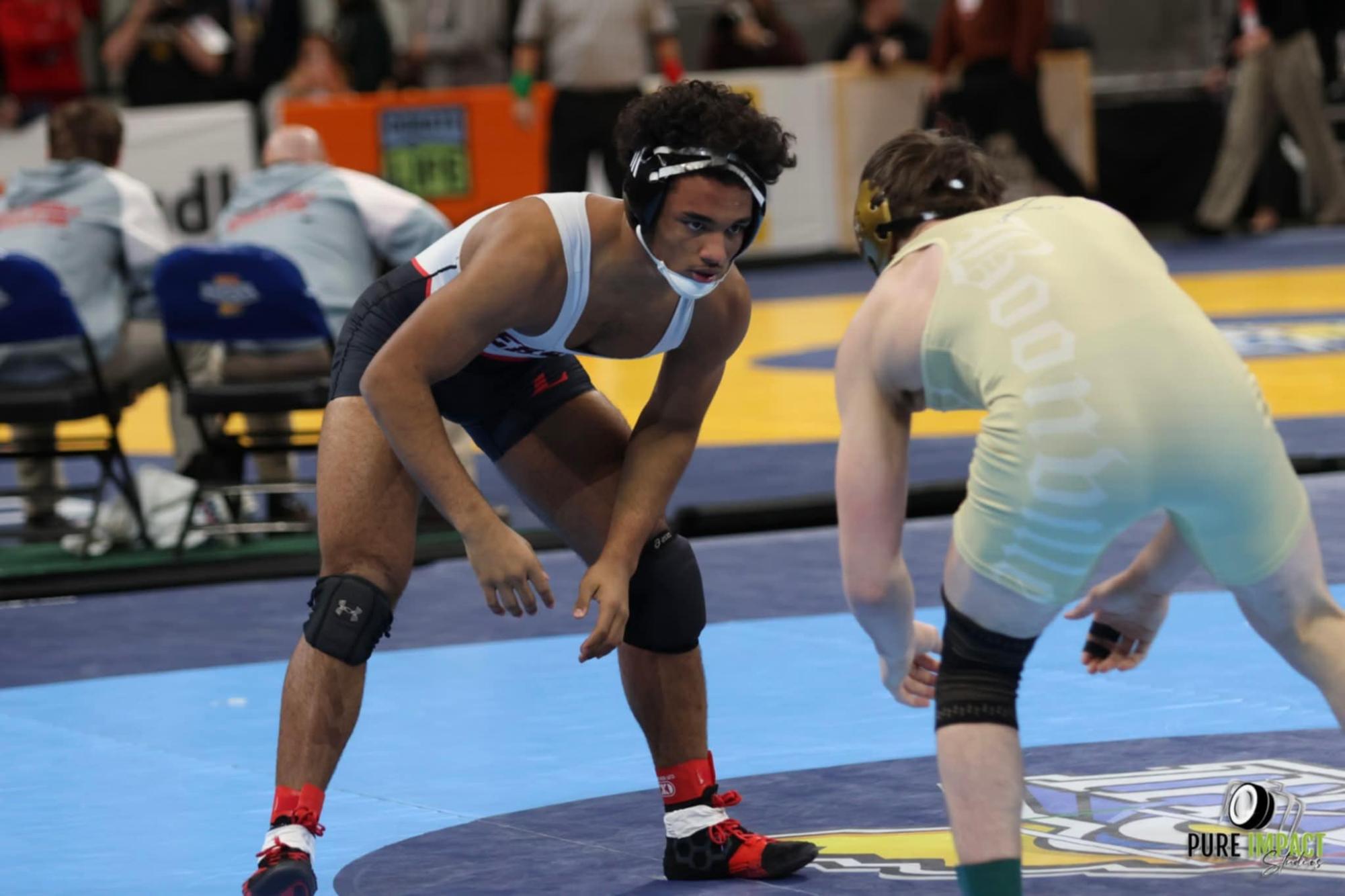Junior Quintin McLeod prepares to wrestle his opponent at the IHSAA Boys Wrestling State Finals. (Courtesy of Sam Fry)