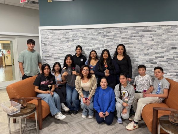 The Diversity Club takes a group picture in the waiting room of Chase Nursing Home. (Courtesy of Fatima Franco)