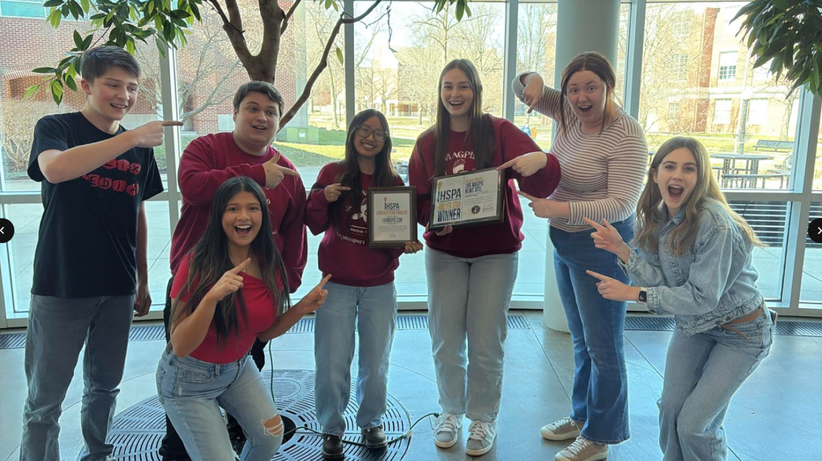 The students who went to the IHSPA convention holding the Hoosier Star finalist and winner awards, including seniors Golda Kitchell, Sydney Vo, Jackson Lythgoe, Reyna Hernandez and Veda Fagner. Along with junior Ellison Kitchell, and sophomore Isaac Szmara. (Courtesy of Chris Pearcy)