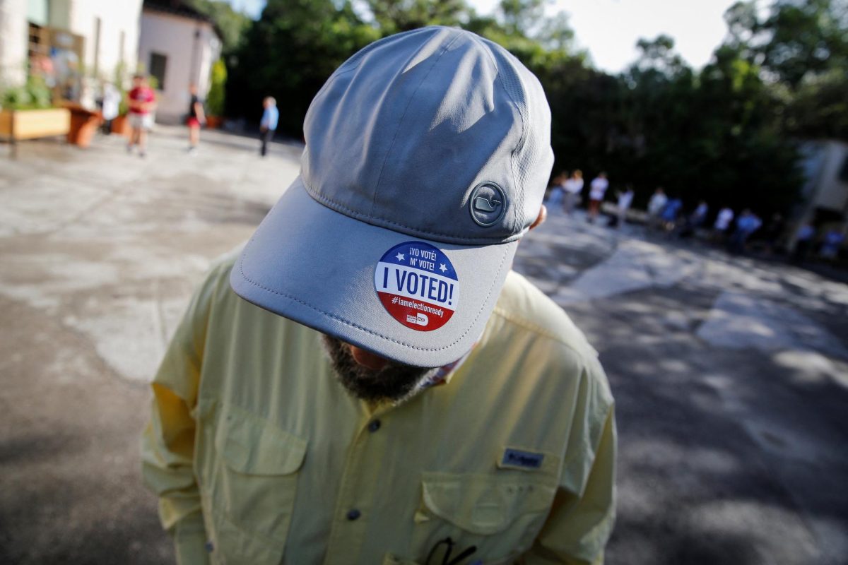 A man wears an "I voted" sticker after casting his vote at a polling centre during the 2022 U.S. midterm election in Miami, Florida, U.S., November 8, 2022. REUTERS/Marco Bello