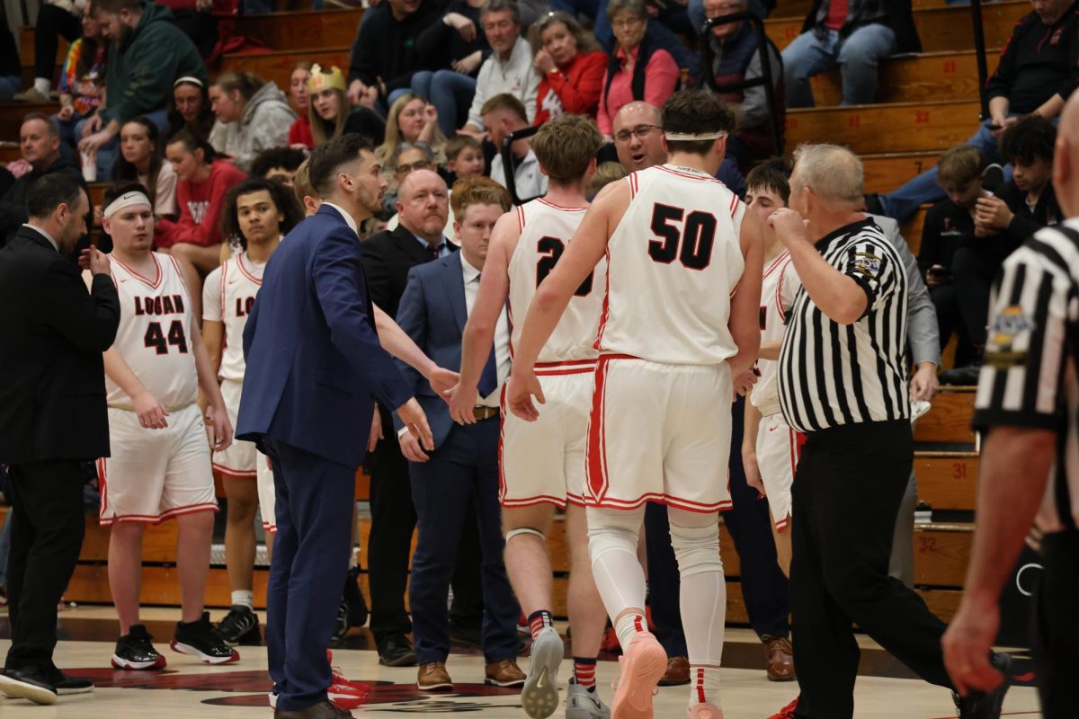 During a break, then Junior Varsity coach Haden Deaton motivates the players in a game against Benton Central.