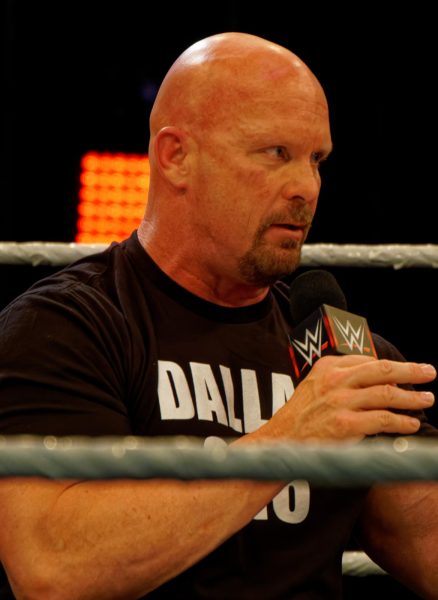 Stone Cold Steve Austin in the WWE ring talking. https://commons.wikimedia.org/w/index.php?curid=157594552