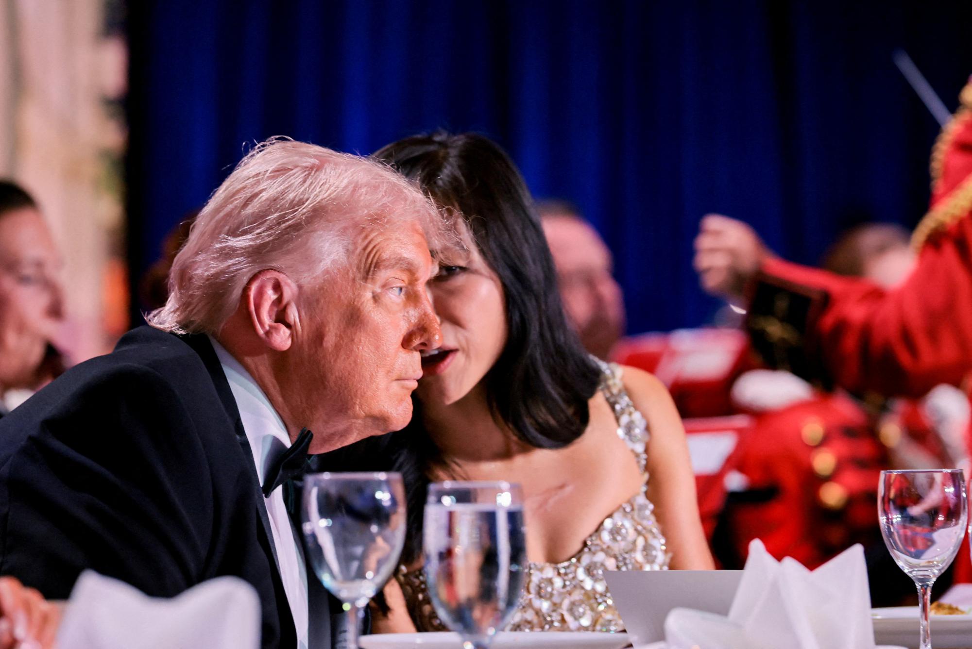 U.S. President Donald Trump listens to CBS News senior White House correspondent Weijia Jiang during the annual White House Correspondents' Association dinner in Washington, D.C., U.S., April 25, 2026. REUTERS/Jonathan Ernst