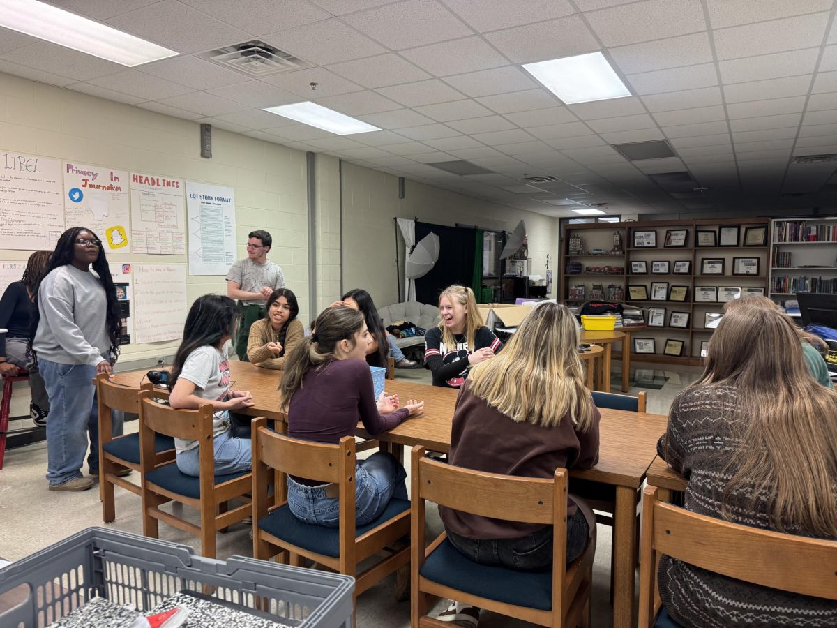 Enjoying Fun Friday, Magpie staff socializes and tries to figure out who the killer is in Mafia, a murder mystery-like game.