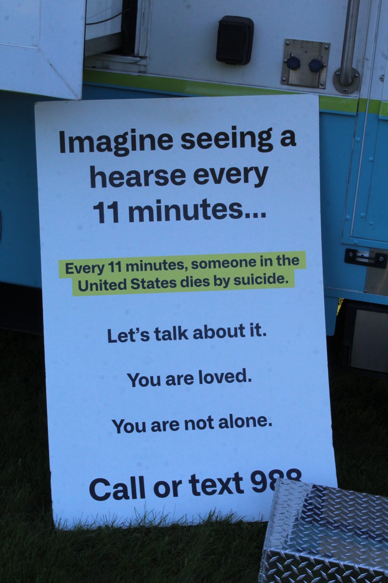 A sign held against the Cass County Health Department truck