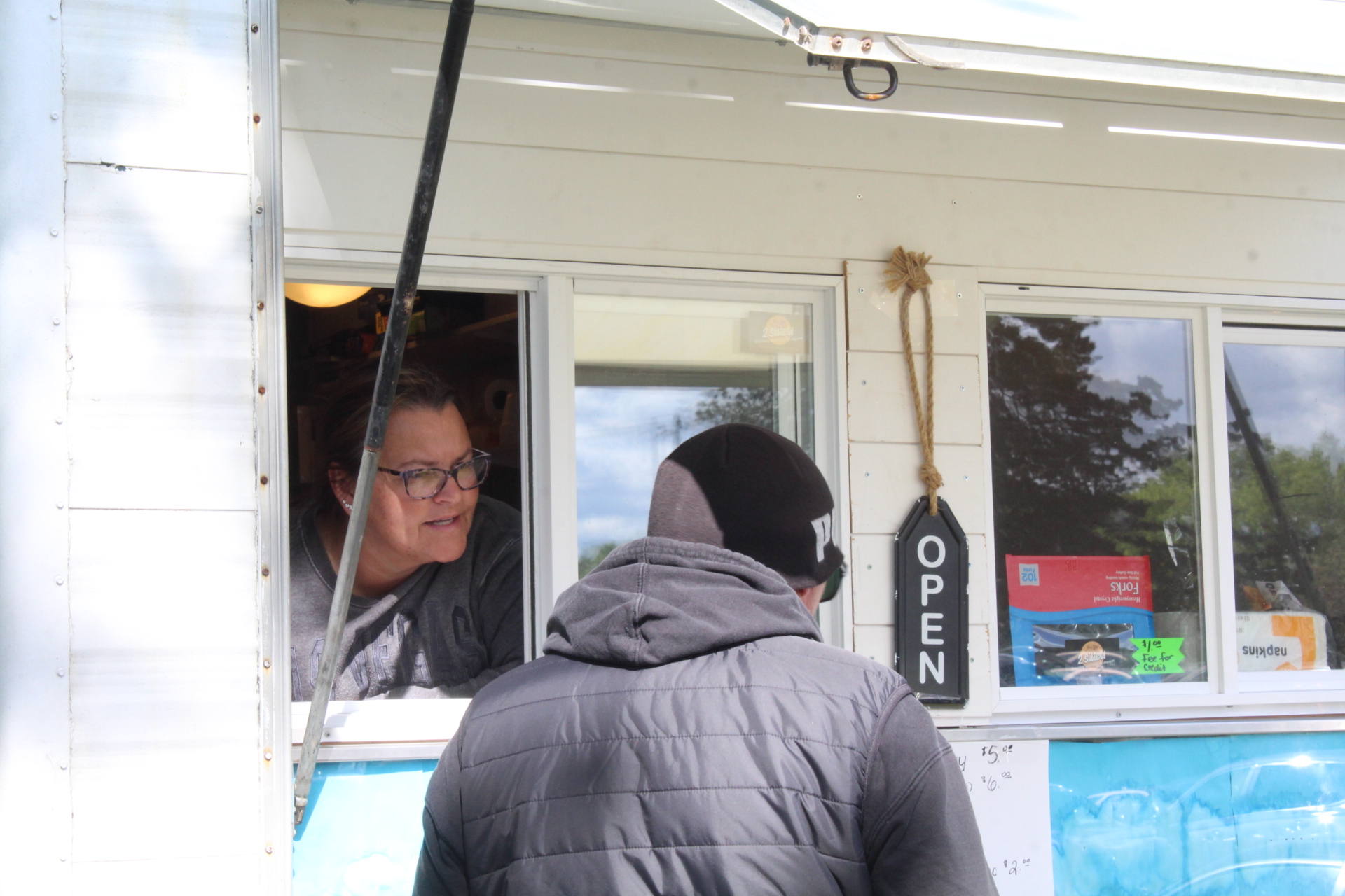 Kellie serving customers at the event