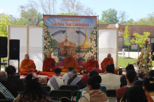 Monks praying on a stage as Buddhist members of the Logansport community pray with them. The Monks all came from different places in Indiana and marked the start of the celebration.